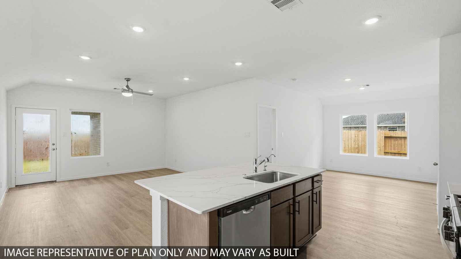 open concept living and dining area with vinyl flooring with quartz countertops
