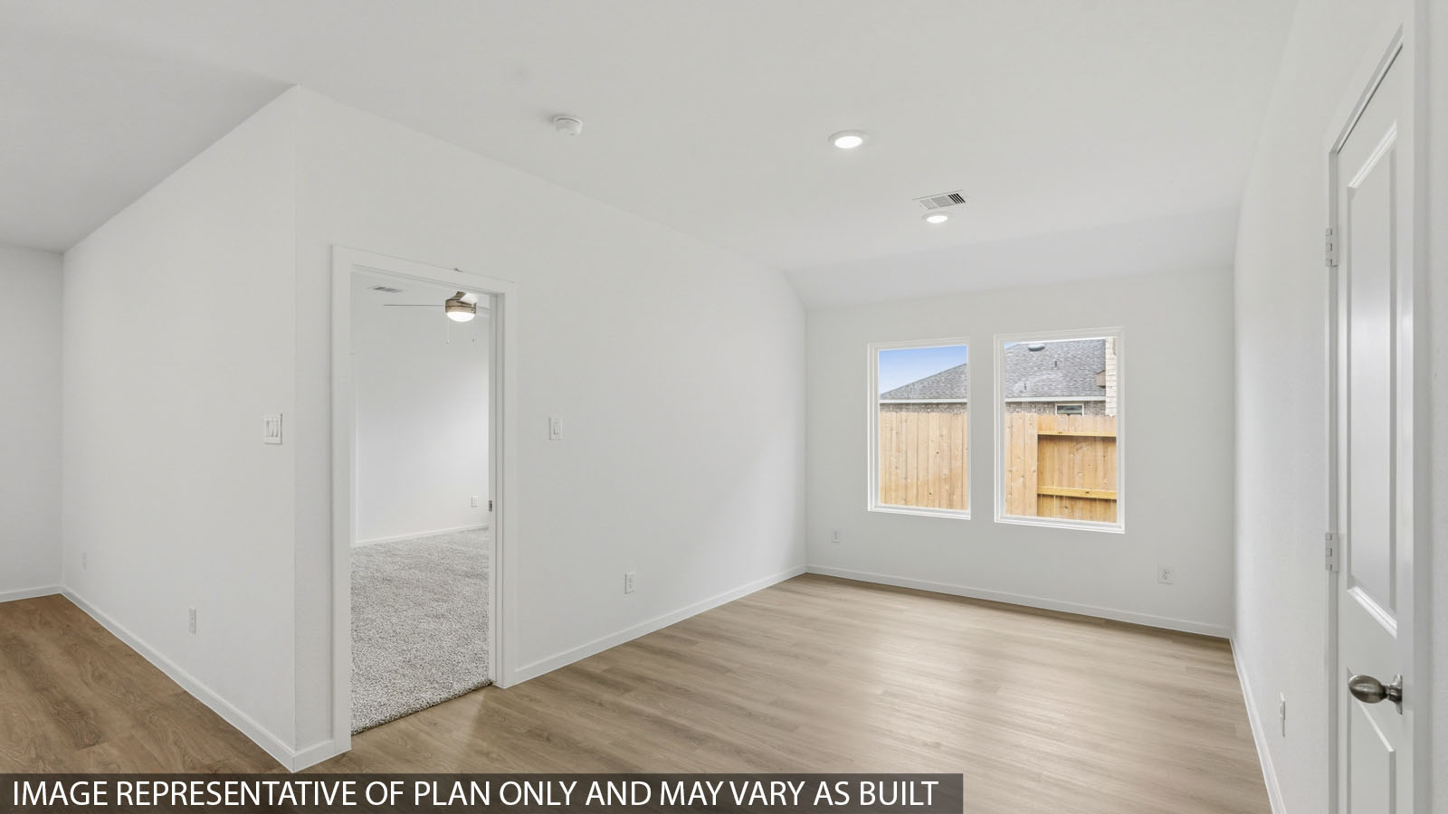open concept living and dining area with vinyl flooring with quartz countertops