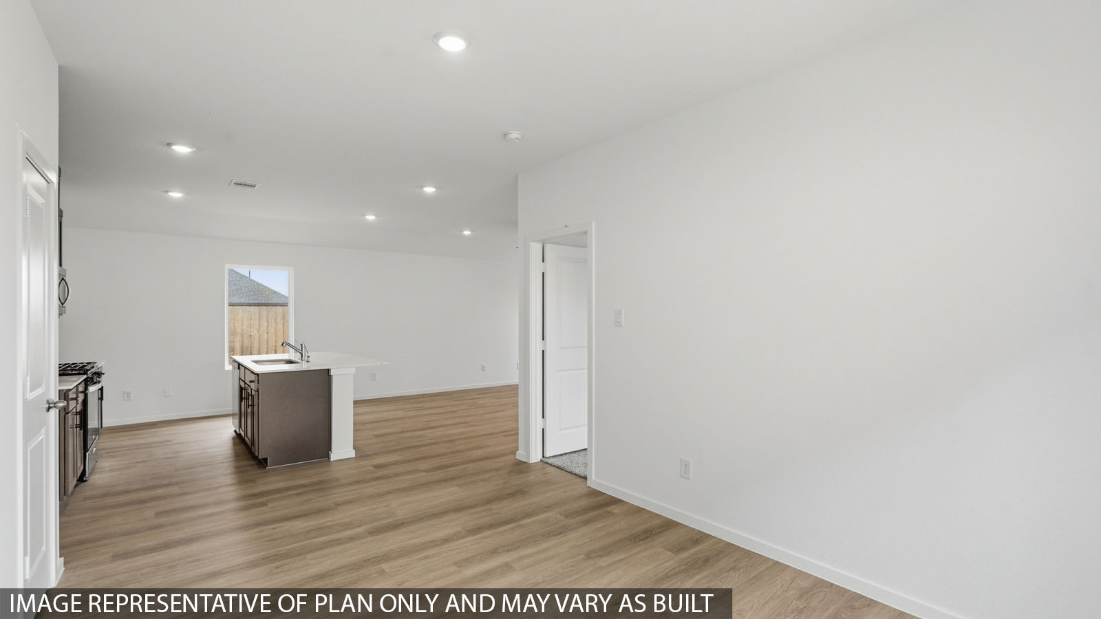 open concept living and dining area with vinyl flooring with quartz countertops