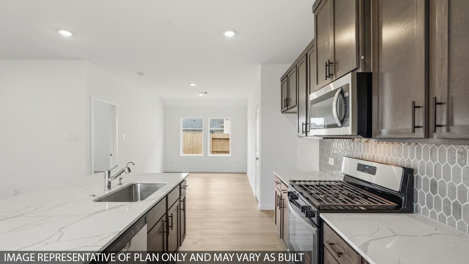 open concept living and dining area with vinyl flooring with quartz countertops