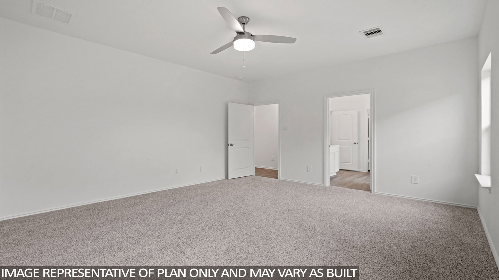 Secondary bedroom with carpet flooring
