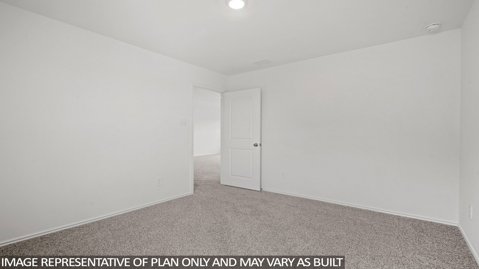 Secondary bedroom with carpet flooring