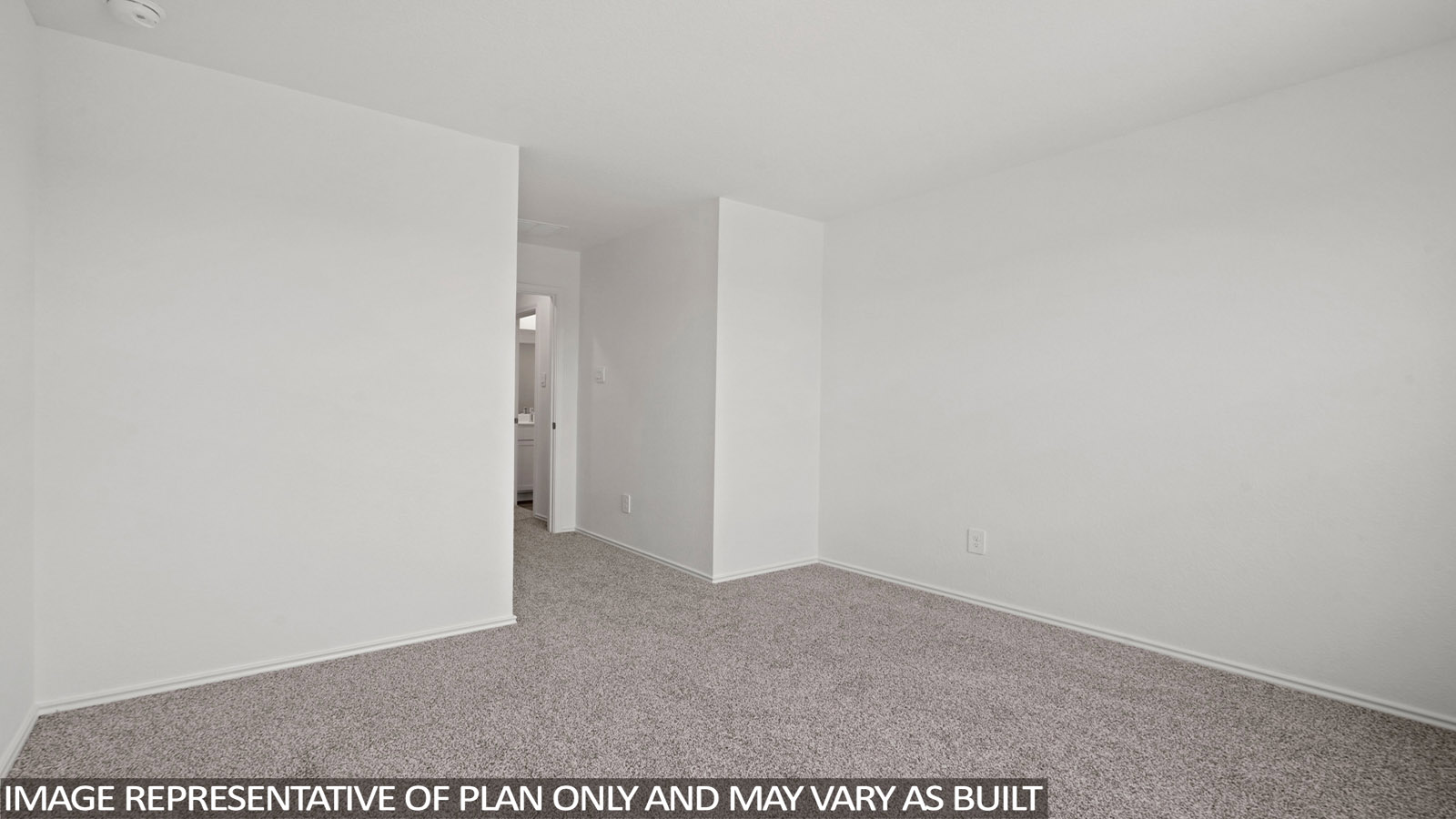 Secondary bedroom with carpet flooring