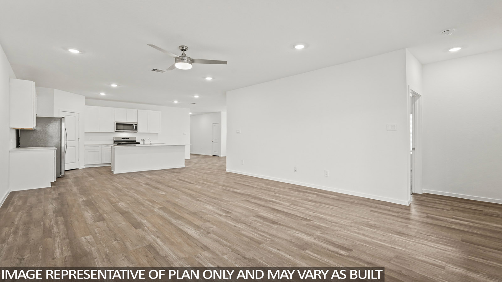 Spacious living area with vinyl flooring