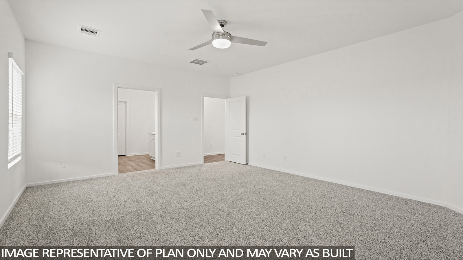 Primary bedroom with carpet flooring