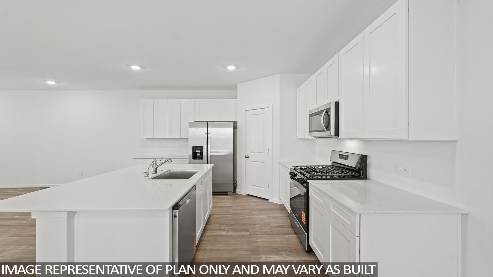 Kitchen with an island and vinyl floor