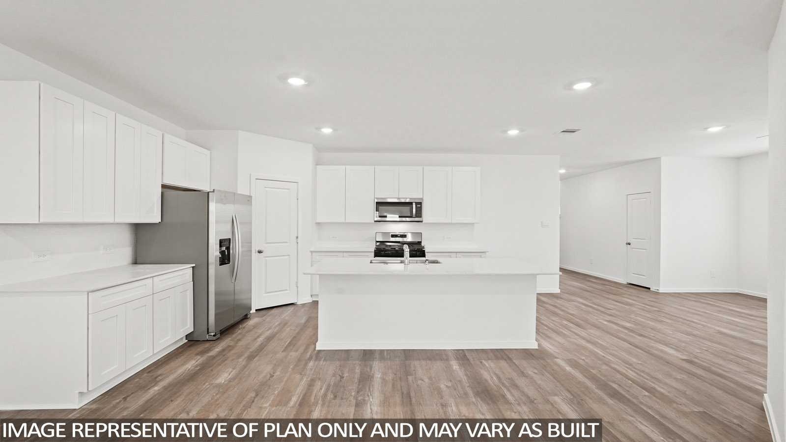 Kitchen with an island and vinyl floor