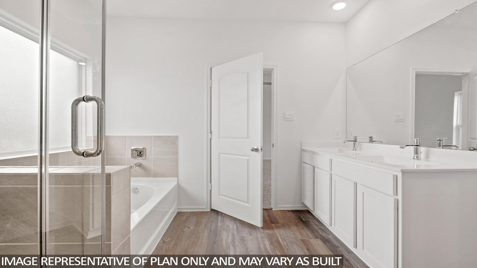 primary bathroom with separate tub and shower