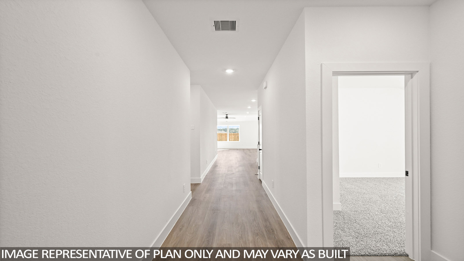 open concept living and dining area with vinyl flooring, quartz countertops, and stainless steel appliances in Katy,Tx