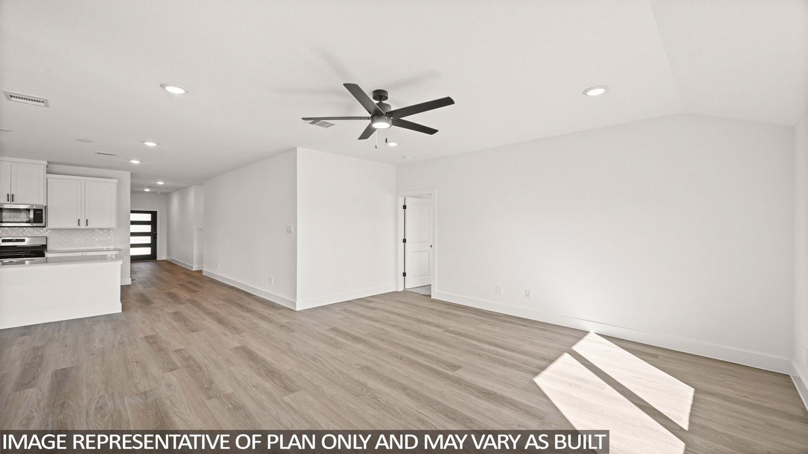 open concept living and dining area with vinyl flooring, quartz countertops, and stainless steel appliances in Katy,Tx
