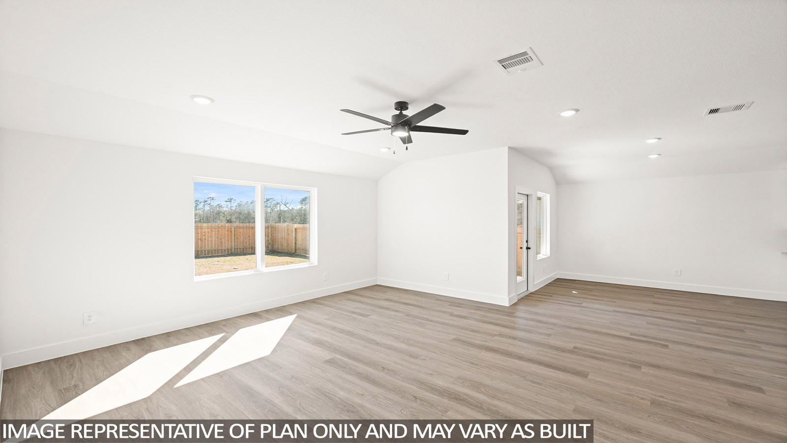 open concept living and dining area with vinyl flooring, quartz countertops, and stainless steel appliances in Katy,Tx