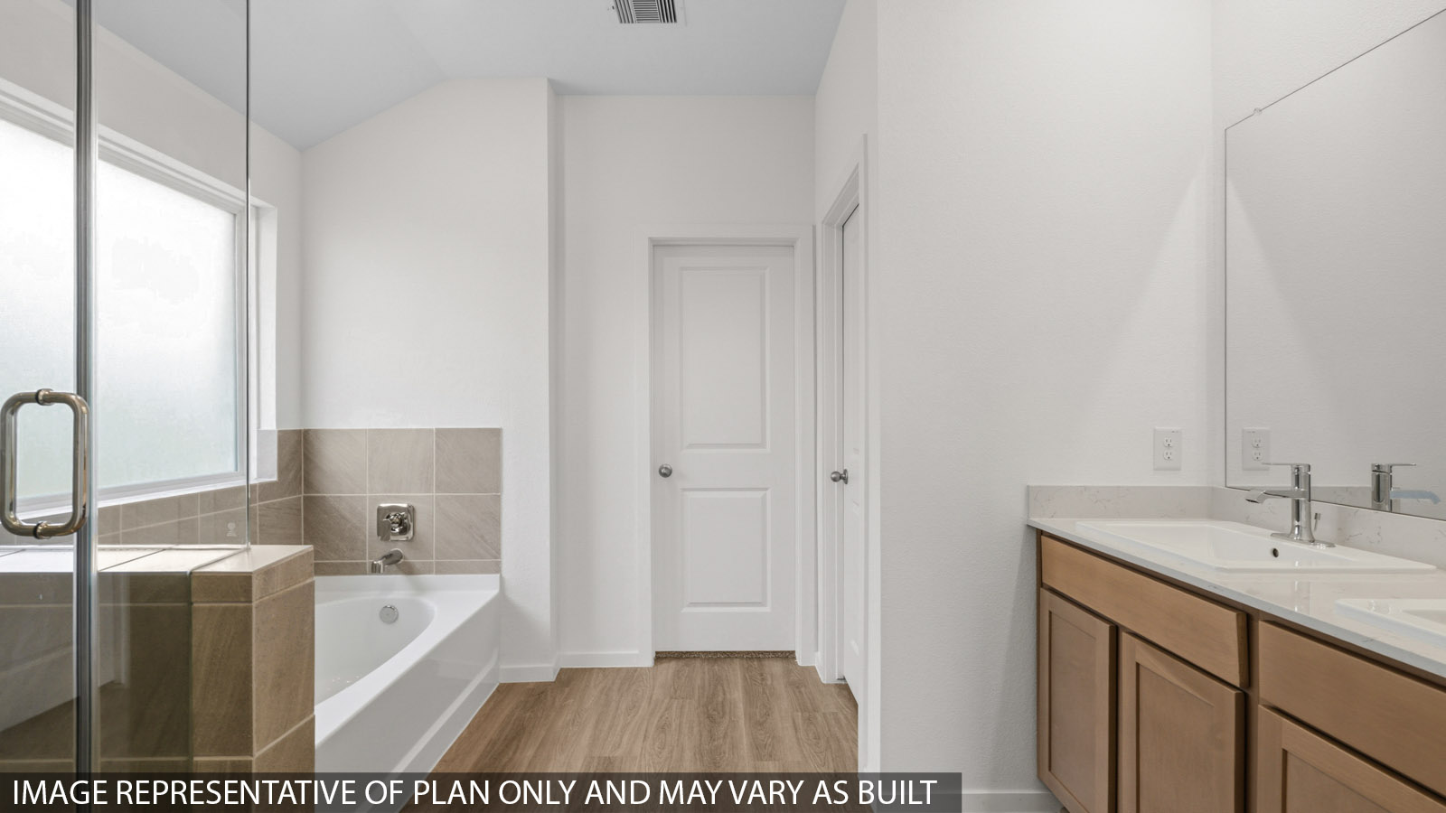 primary bathroom with separate tub and shower