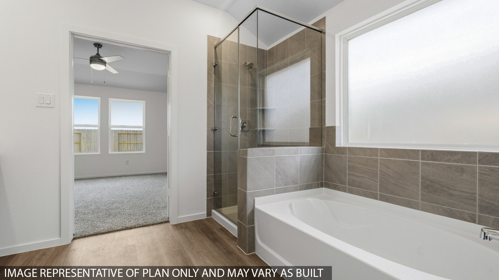primary bathroom with separate tub and shower
