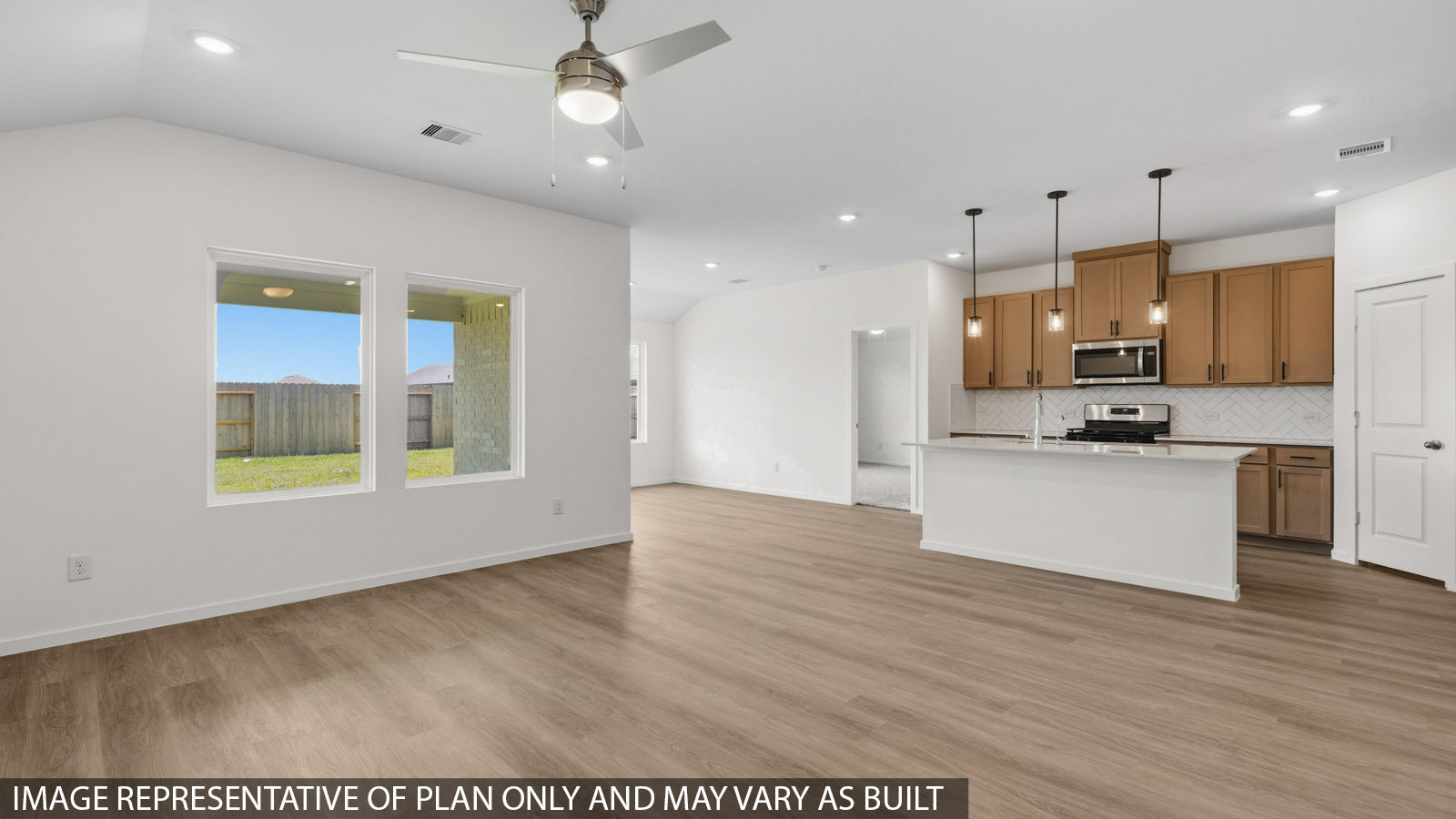 open concept living and dining area with vinyl flooring and large windows