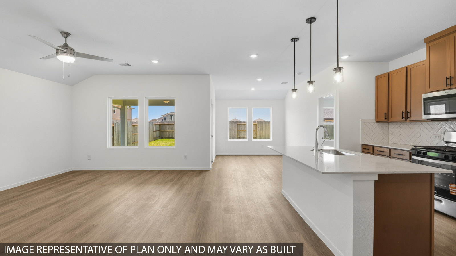 Spacious living area with vinyl flooring and bright windows in Katy TX