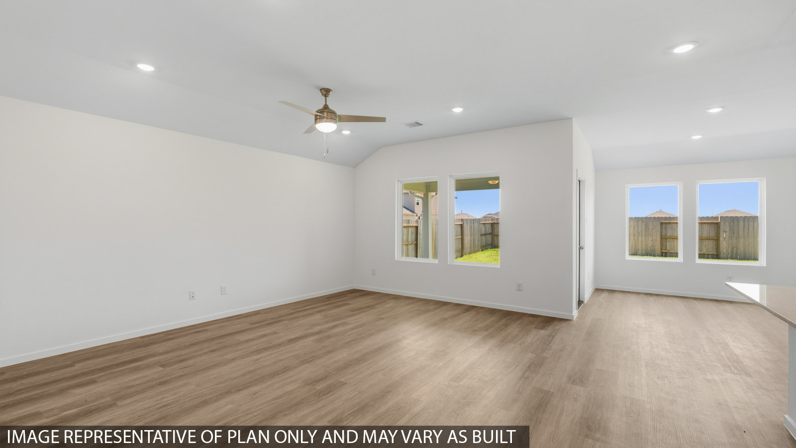 Spacious living area with vinyl flooring and bright windows in Katy TX