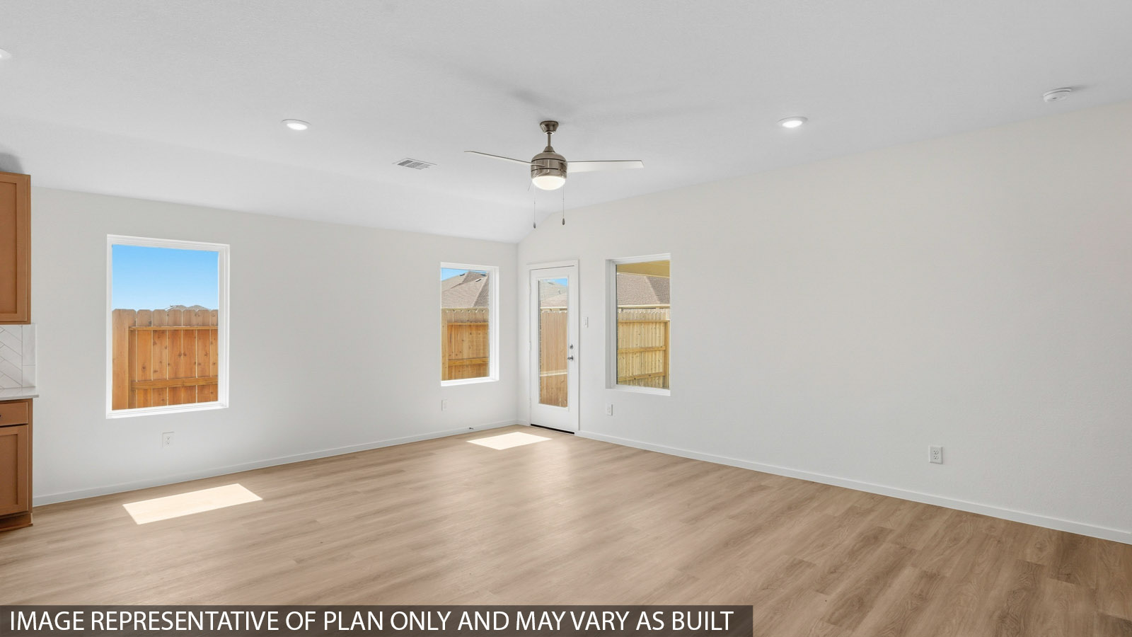 open concept living and dining area with vinyl flooring and large windows