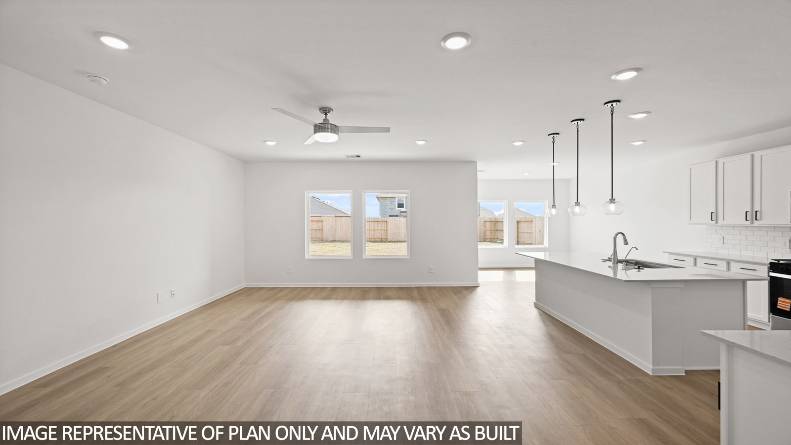 open concept living and dining area with vinyl flooring