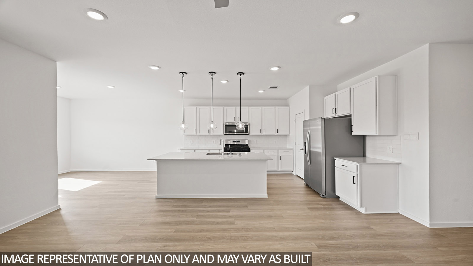 open concept living and dining area with vinyl flooring