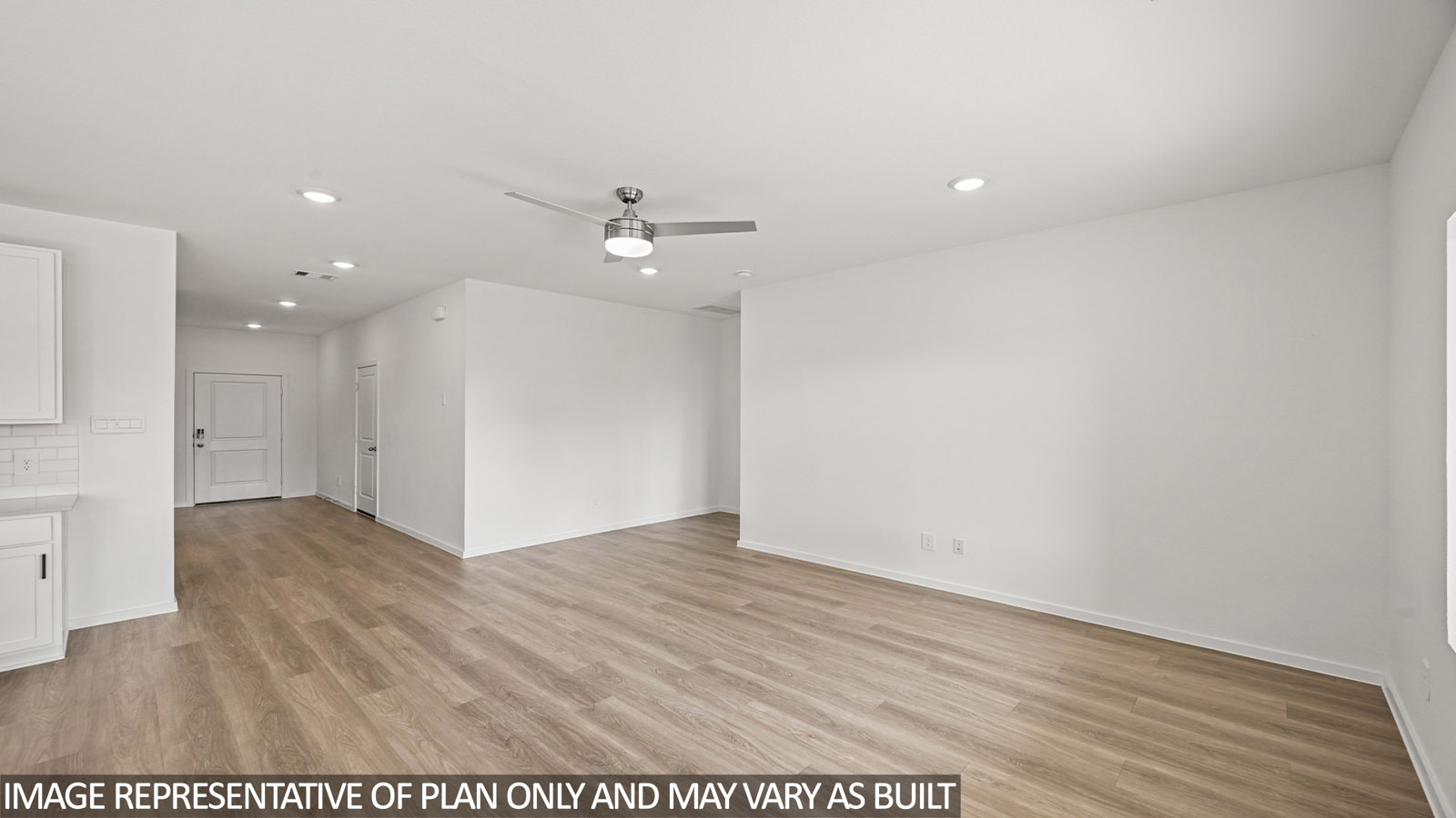 open concept living and dining area with vinyl flooring