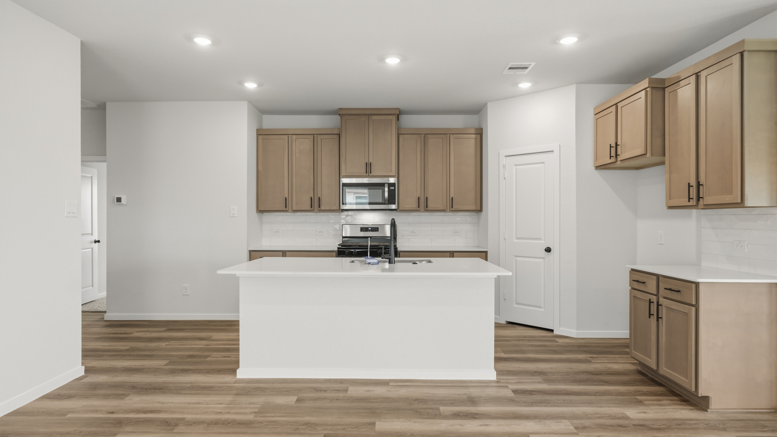 kitchen with quartz countertops and stainless steel appliances