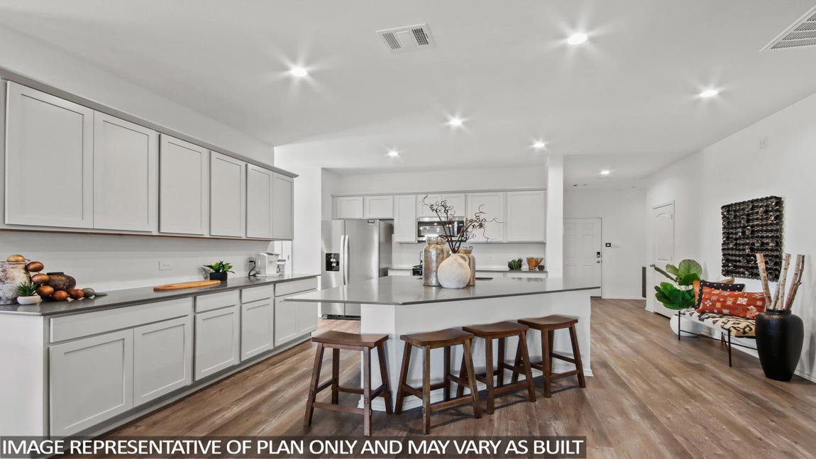 open concept living and dining area with vinyl flooring, large windows, and quartz countertops