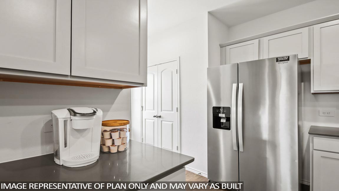 open concept living and dining area with vinyl flooring, large windows, and quartz countertops