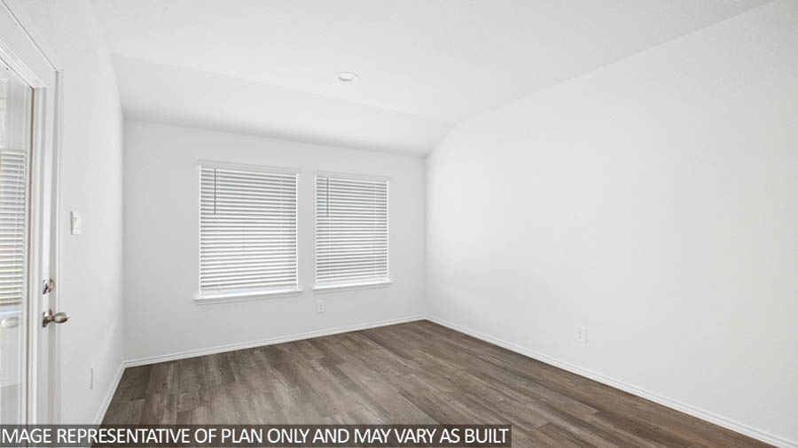 Spacious living area with vinyl flooring