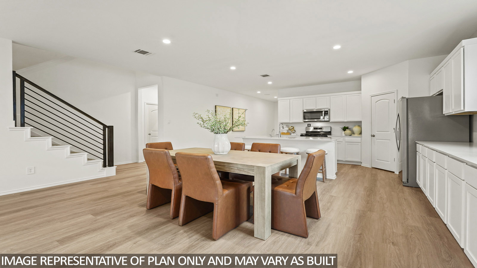 open concept living and dining area with vinyl flooring
