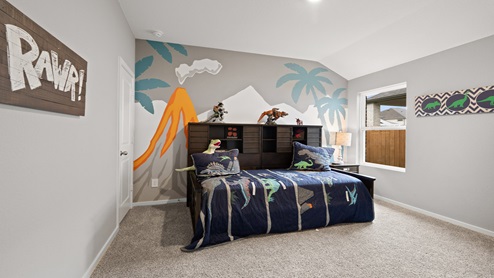 Secondary bedroom with windows, white walls, and light carpet.