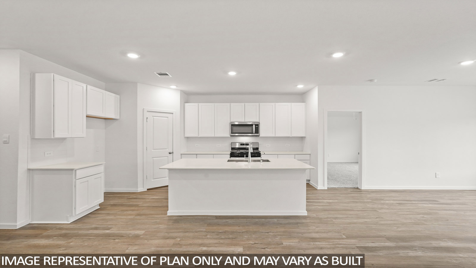 open concept living room with vinyl flooring, quartz countertops, and large windows