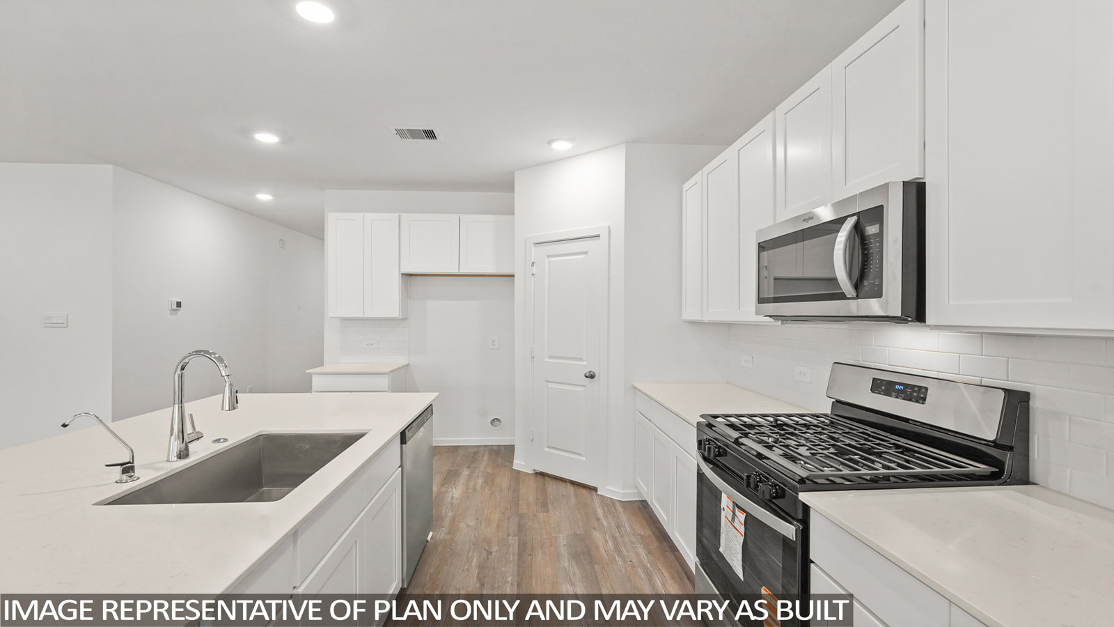 open concept living room with vinyl flooring, quartz countertops, and large windows