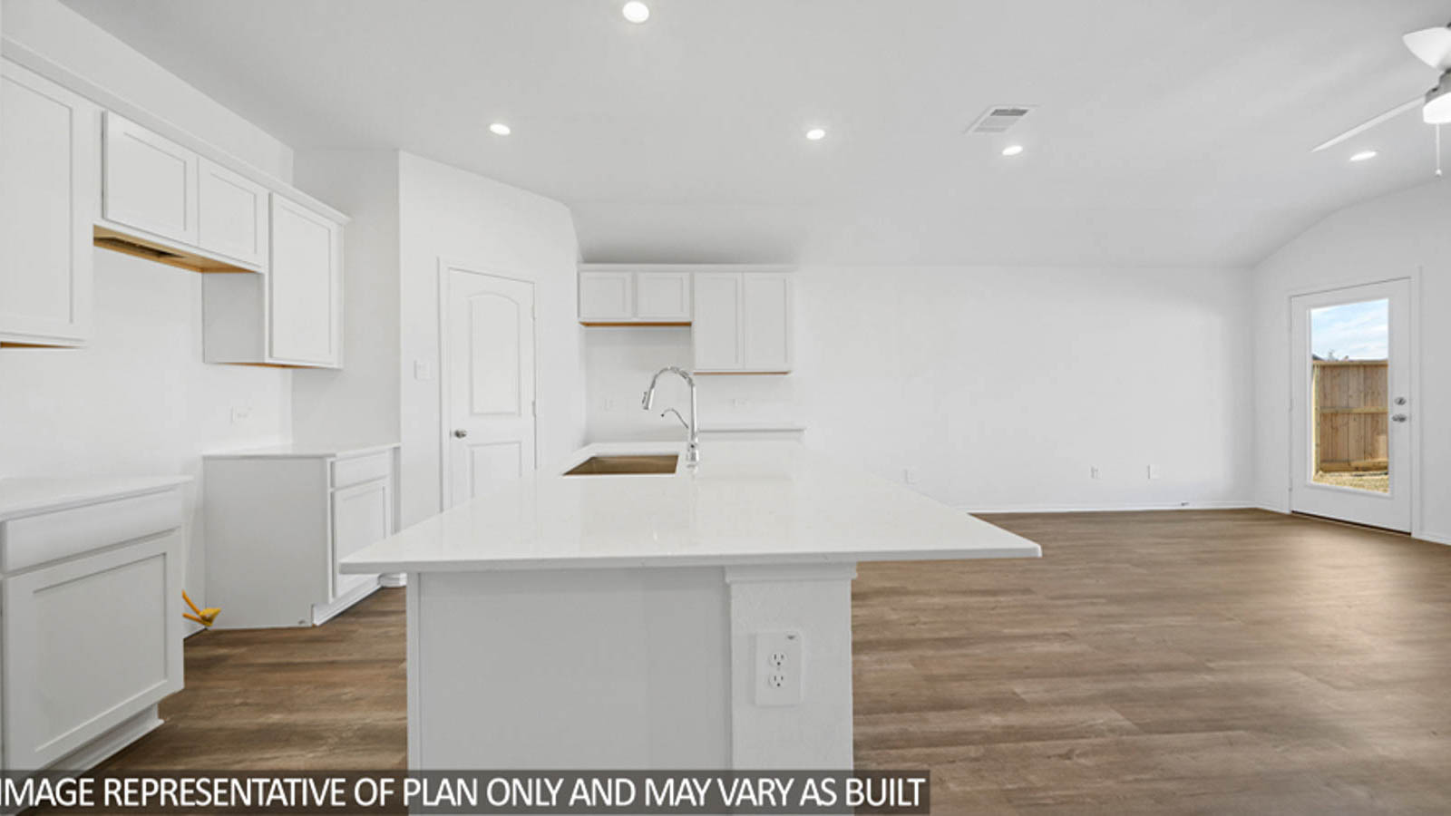 open cncept living and dining area with vinyl flooring, large windows, and quartz countertops in Katy, TX