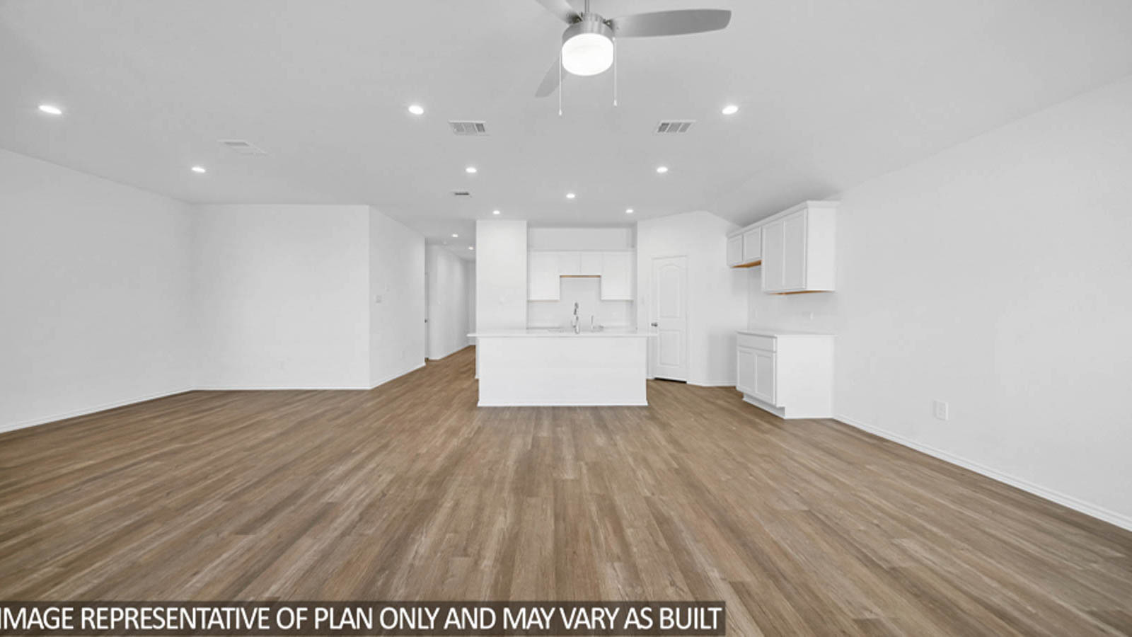 open cncept living and dining area with vinyl flooring, large windows, and quartz countertops in Katy, TX