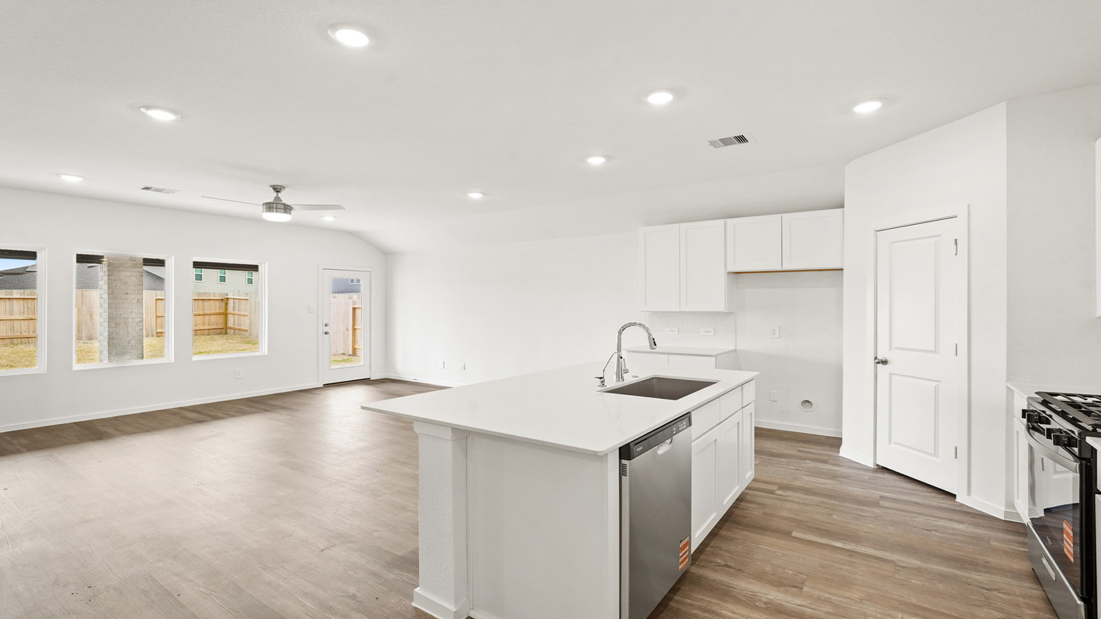 open concept living and dining area with vinyl flooring