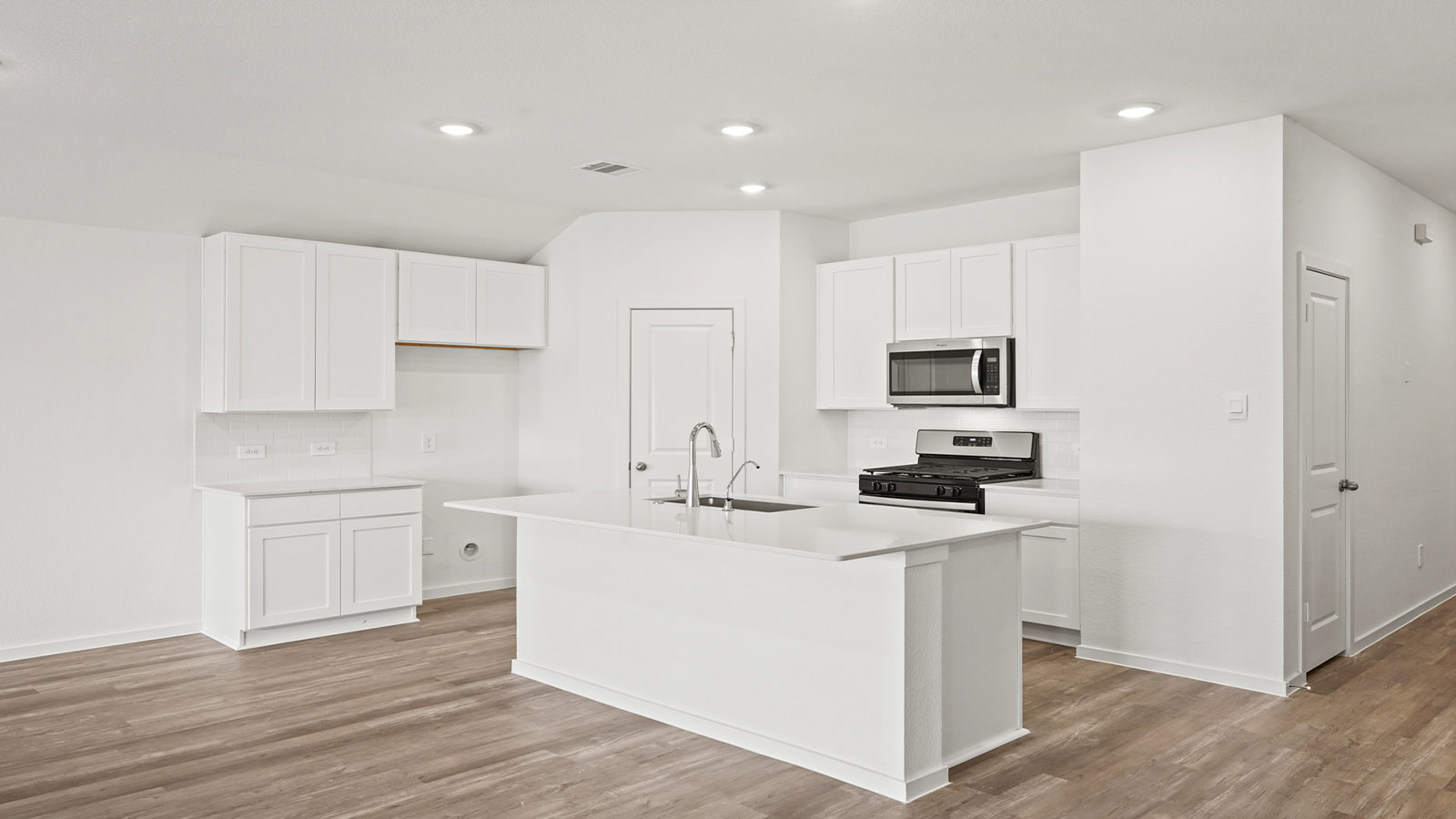 open concept living and dining area with vinyl flooring
