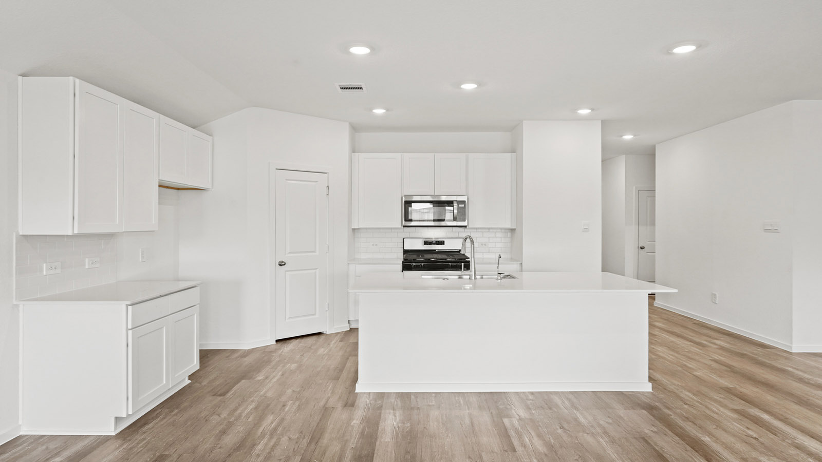 open concept living and dining area with vinyl flooring