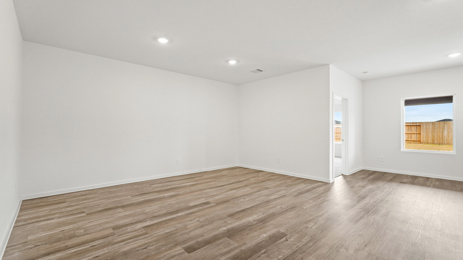 open concept living and dining area with vinyl flooring