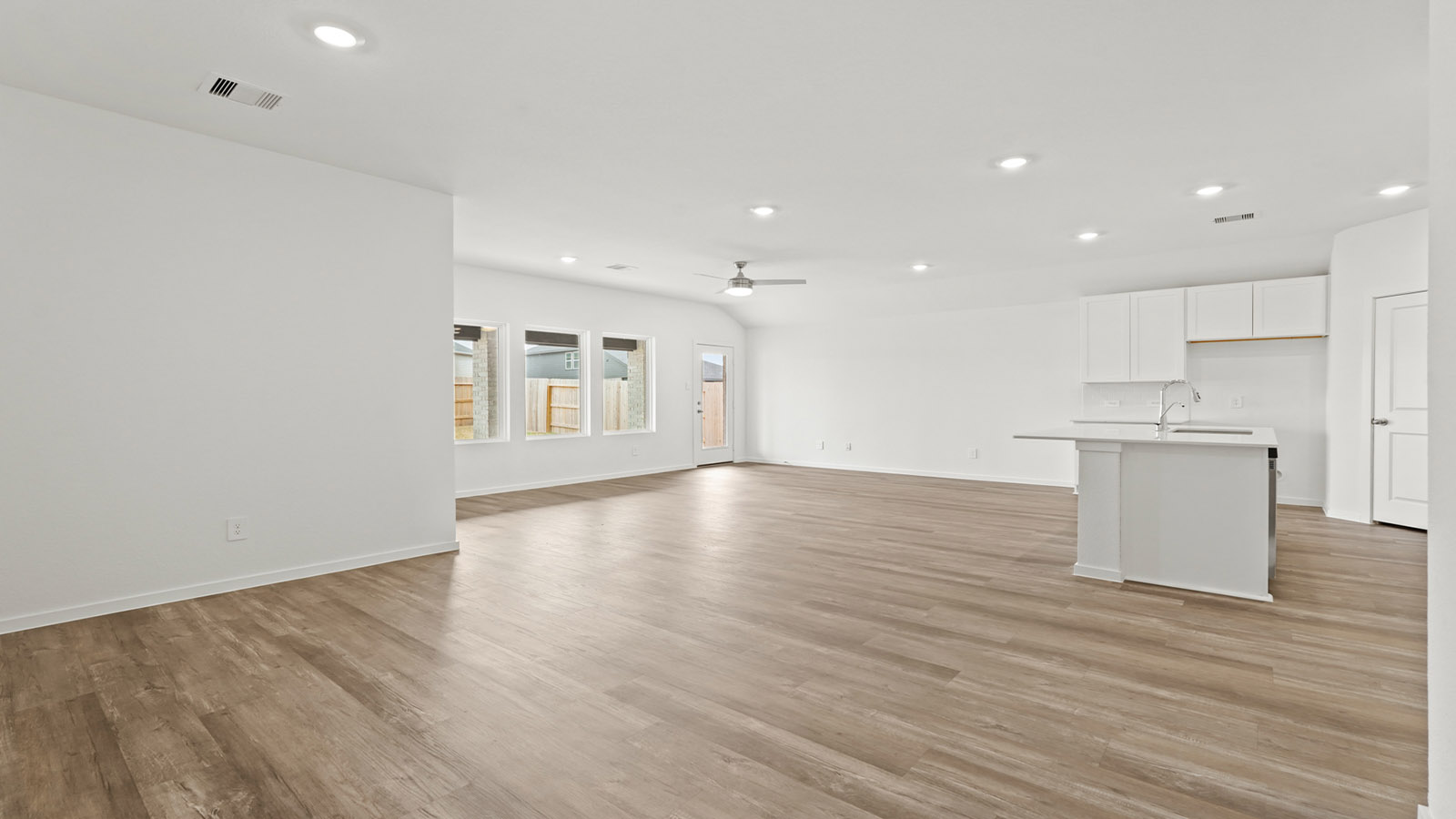 open concept living and dining area with vinyl flooring