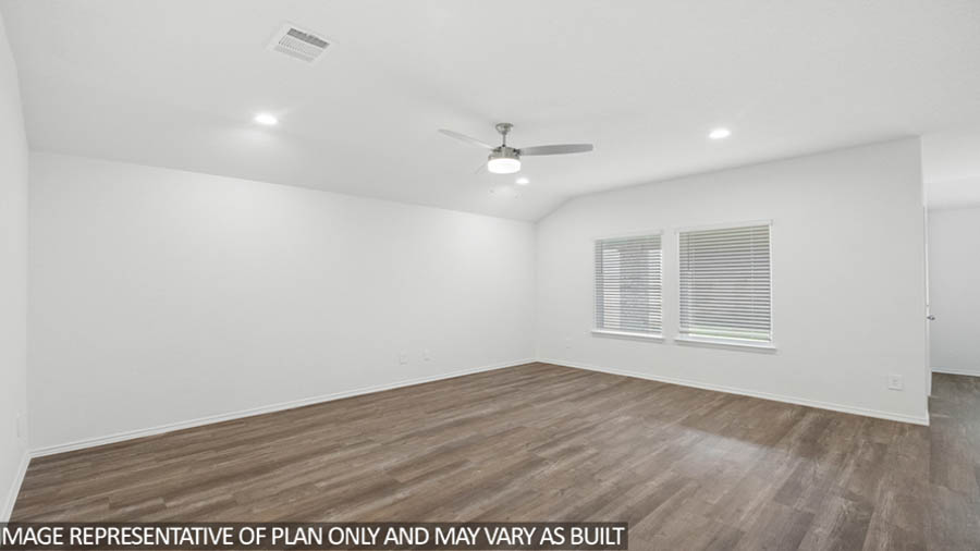 Open living room with windows, white walls, and vinyl wood flooring.