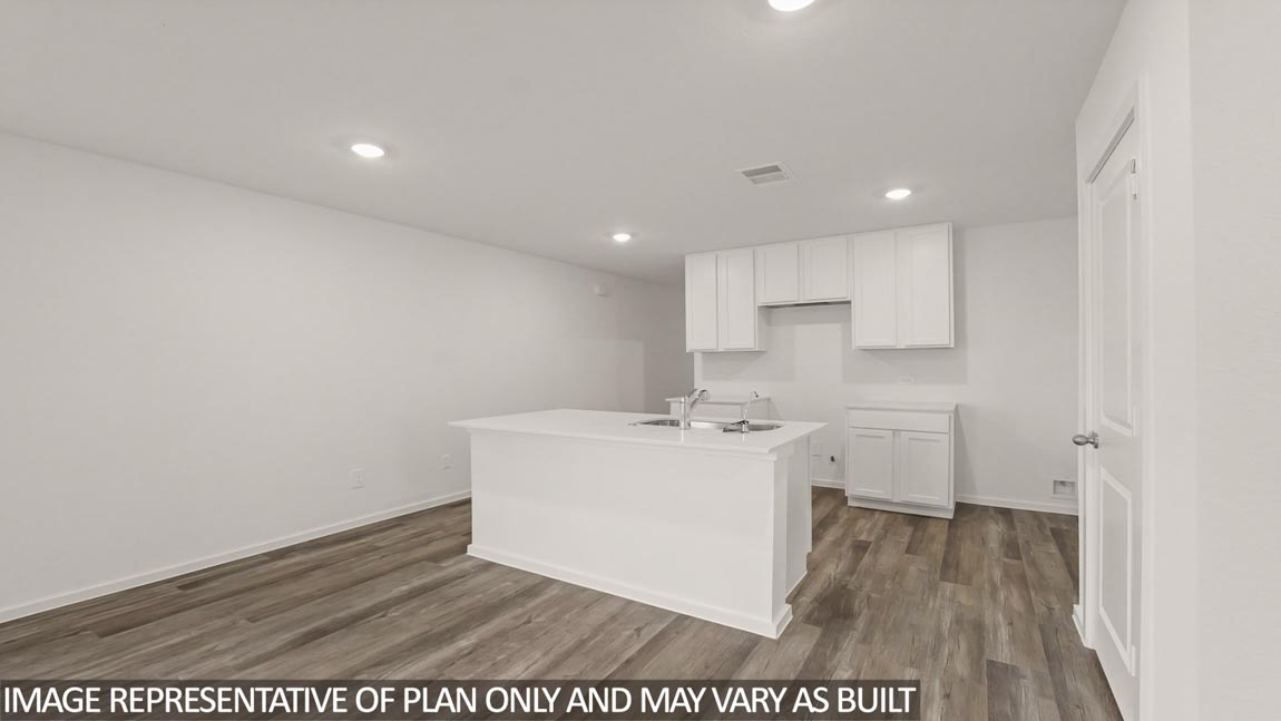 Open concept living and dining area with vinyl flooring and quartz countertops