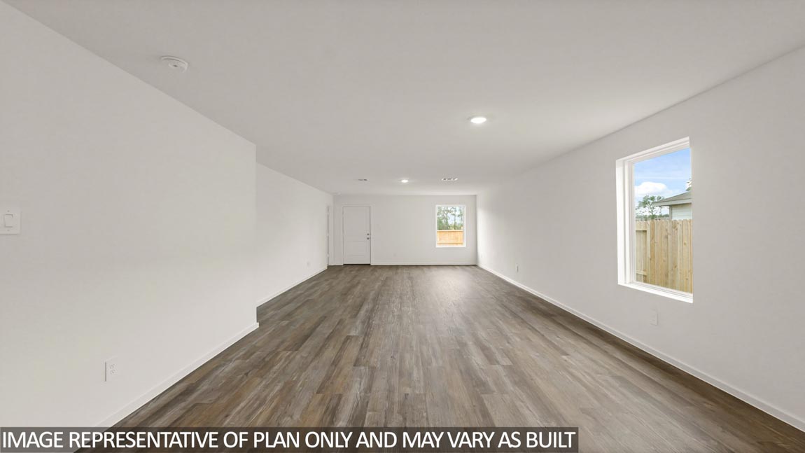 Open concept living and dining area with vinyl flooring and quartz countertops