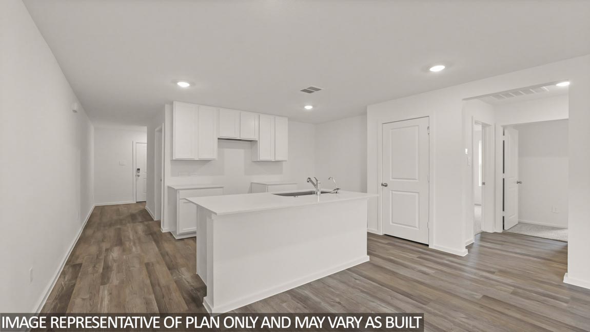 Open concept living and dining area with vinyl flooring and quartz countertops