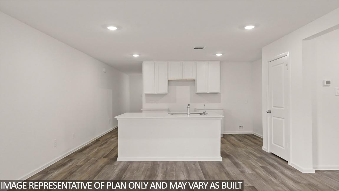 Open concept living and dining area with vinyl flooring and quartz countertops