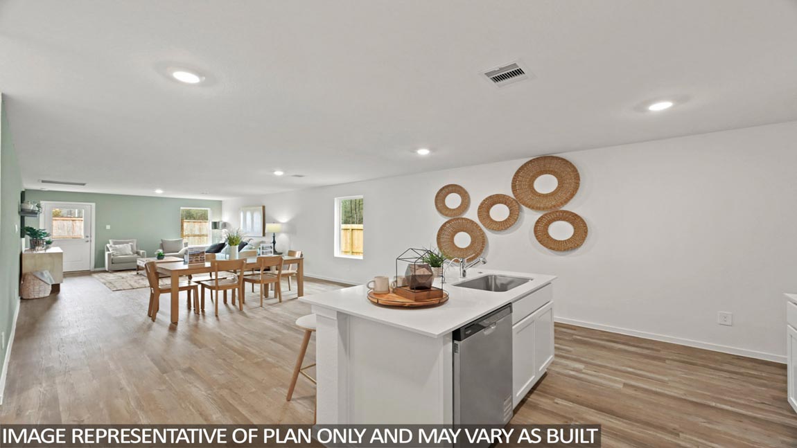 open concept livivng and dining area with vinyl flooring, quartz countertops, and large windows