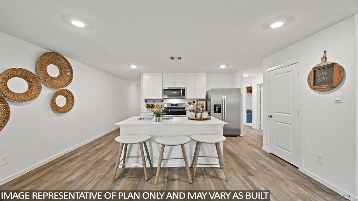 open concept living and diding area with vinyl flooring, quartz countertops, and large windows