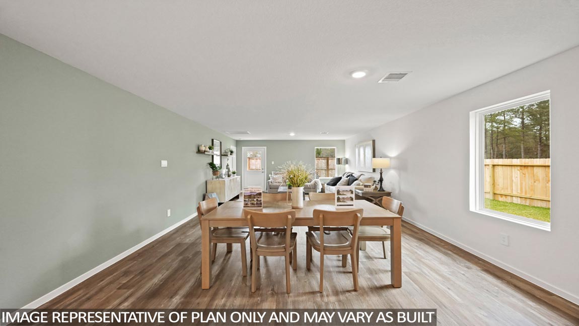 open concept living and diding area with vinyl flooring, quartz countertops, and large windows