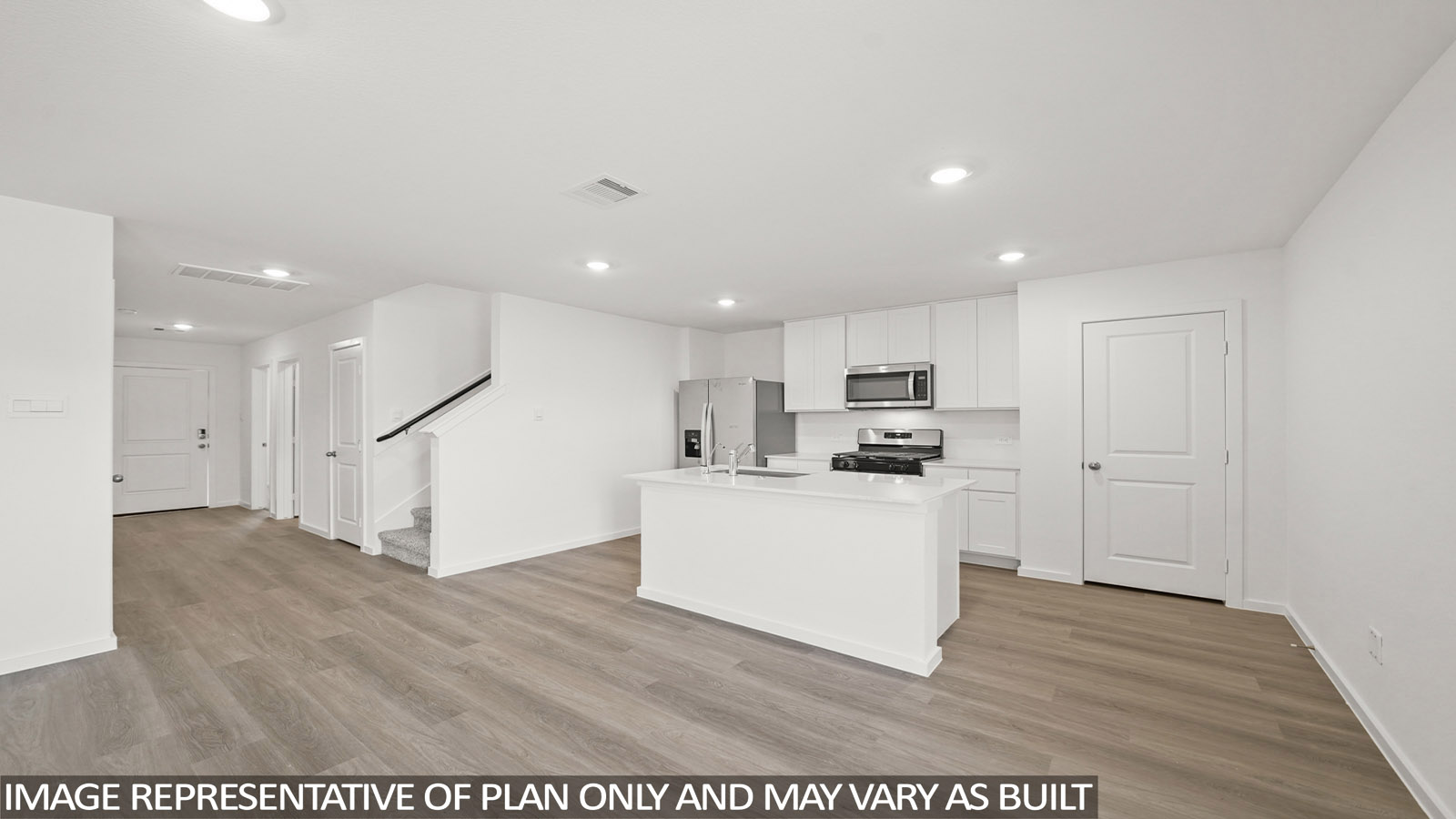 open concept living and dining area with vinyl flooring, quartz countertops, and stainless steel appliances