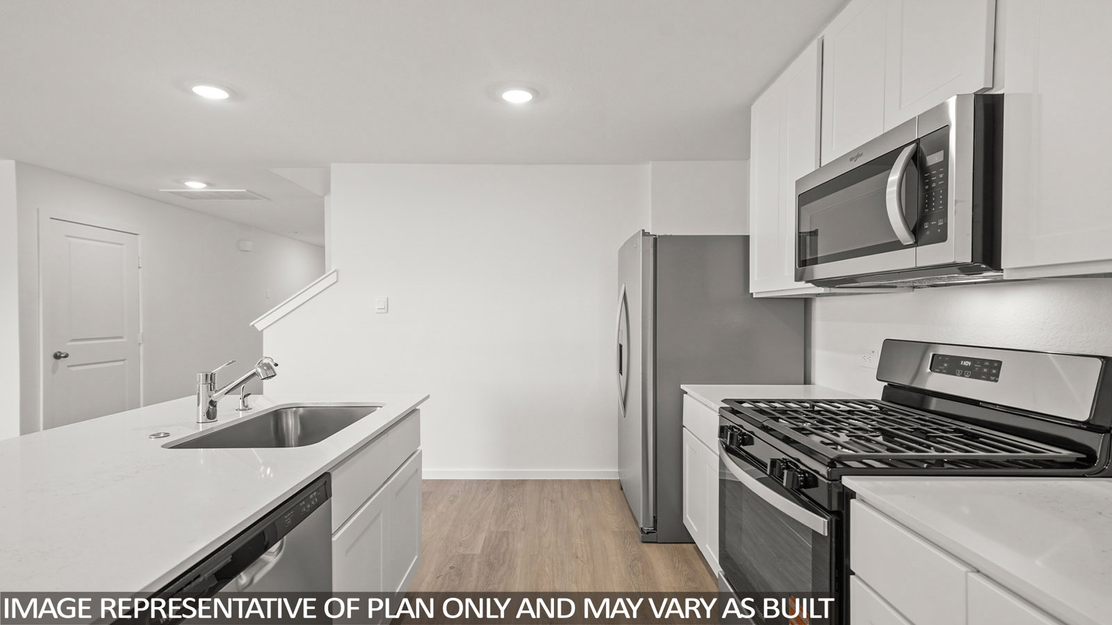 open concept living and dining area with vinyl flooring, quartz countertops, and stainless steel appliances