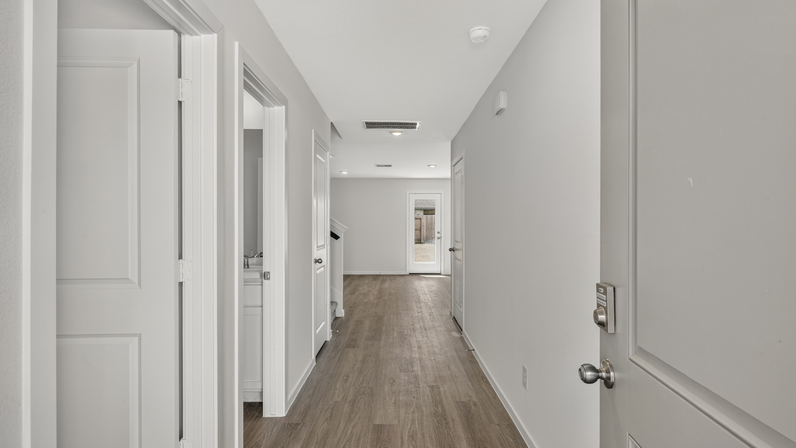 hallway with vinyl flooring